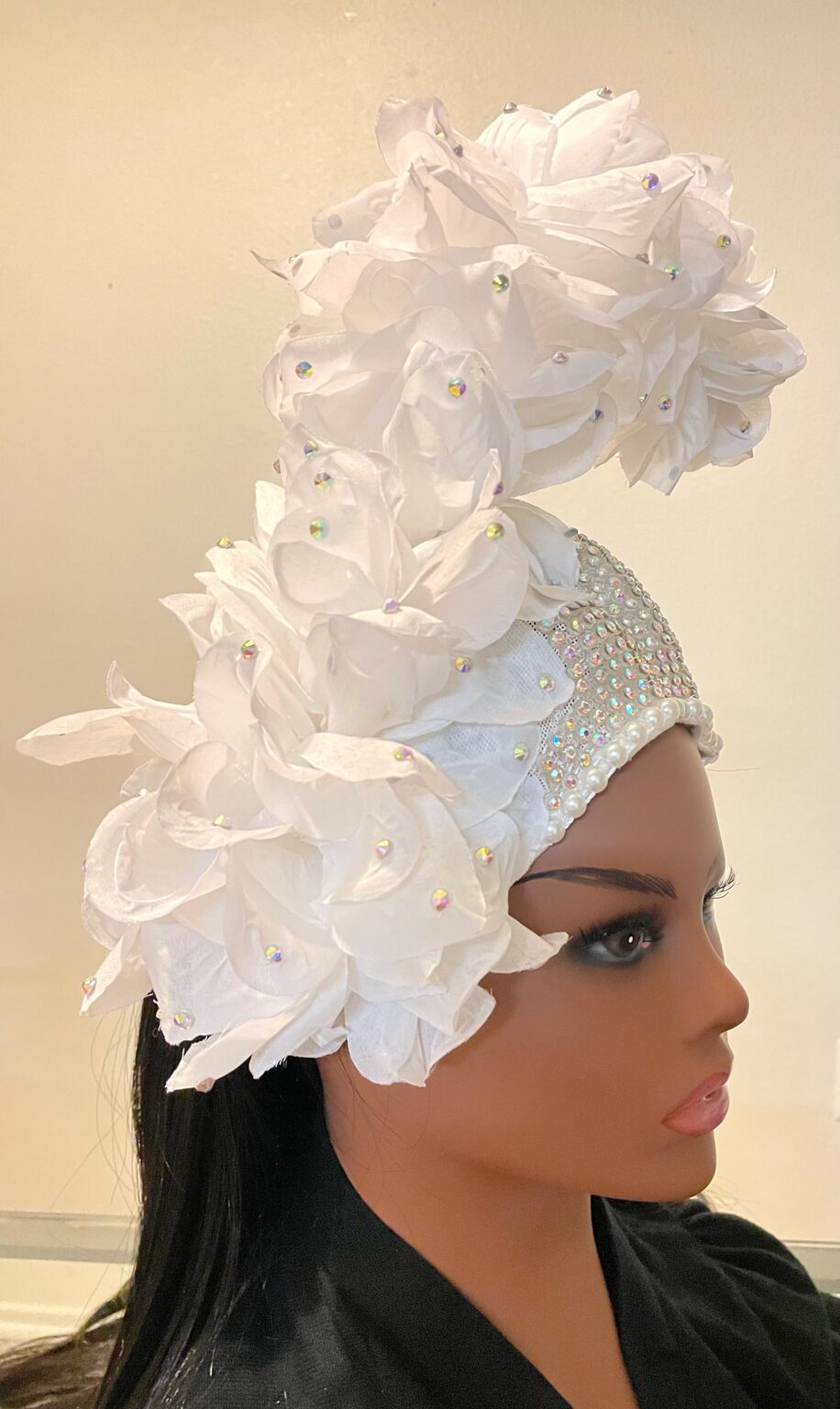 white hat with crystal and white fascinator with flowers